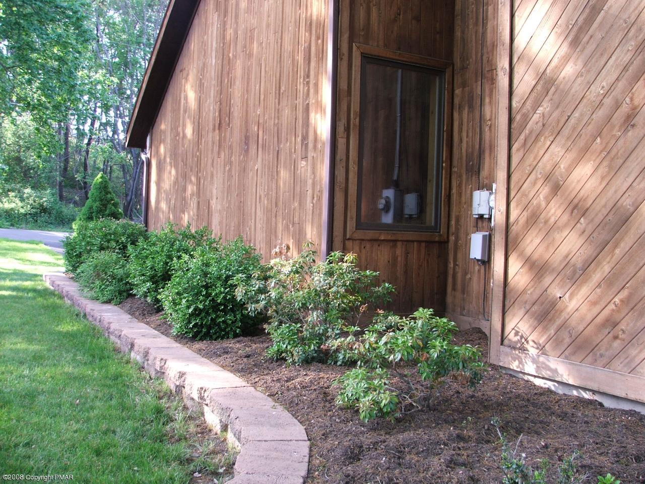 221 Edgemont Road Stroudsburg, PA 18360 - Photo 26 of 30 Side Yard & Stone Lined Flower Beds