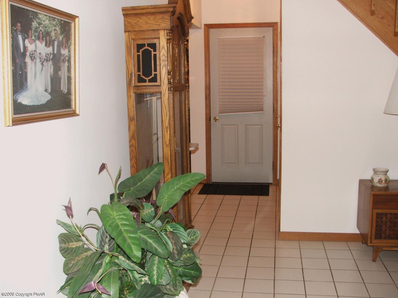 221 Edgemont Road Stroudsburg, PA 18360 - Photo 10 of 30 Hallway to Garage & LL Family Room