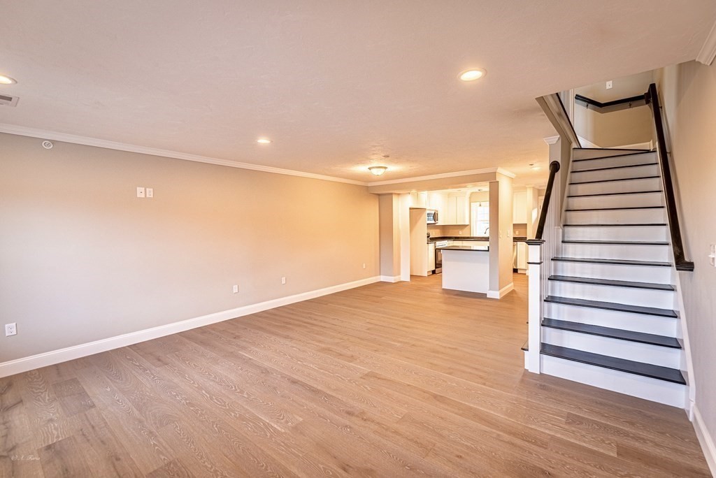 49 Riverside Drive, Unit 49A Lakeville, MA 02347 - Photo 12 of 31 a view of a room with wooden floor and staircase