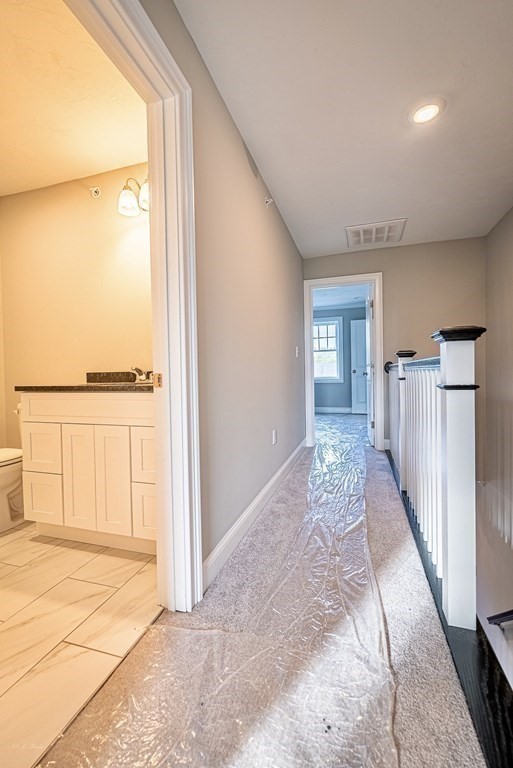 49 Riverside Drive, Unit 49A Lakeville, MA 02347 - Photo 16 of 31 a view of entryway with wooden floor and a rug