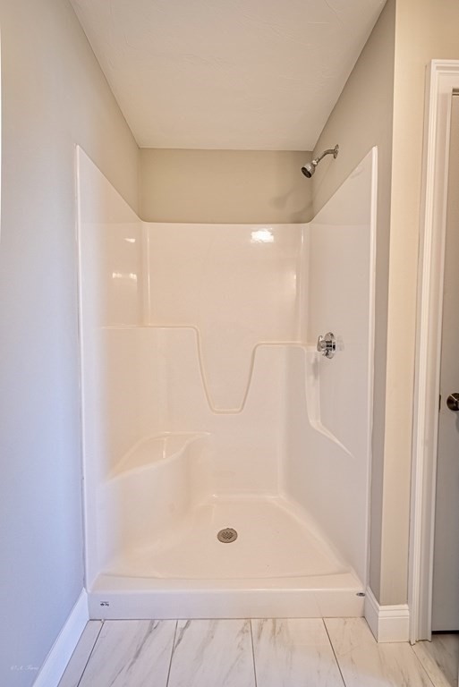 49 Riverside Drive, Unit 49A Lakeville, MA 02347 - Photo 21 of 31 a bathroom with a glass shower door