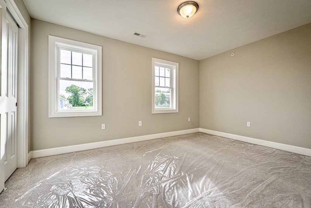 49 Riverside Drive, Unit 49A Lakeville, MA 02347 - Photo 22 of 31 an empty room with windows