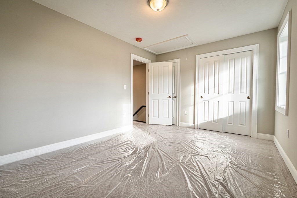 49 Riverside Drive, Unit 49A Lakeville, MA 02347 - Photo 23 of 31 a view of a livingroom with wooden floor and closet