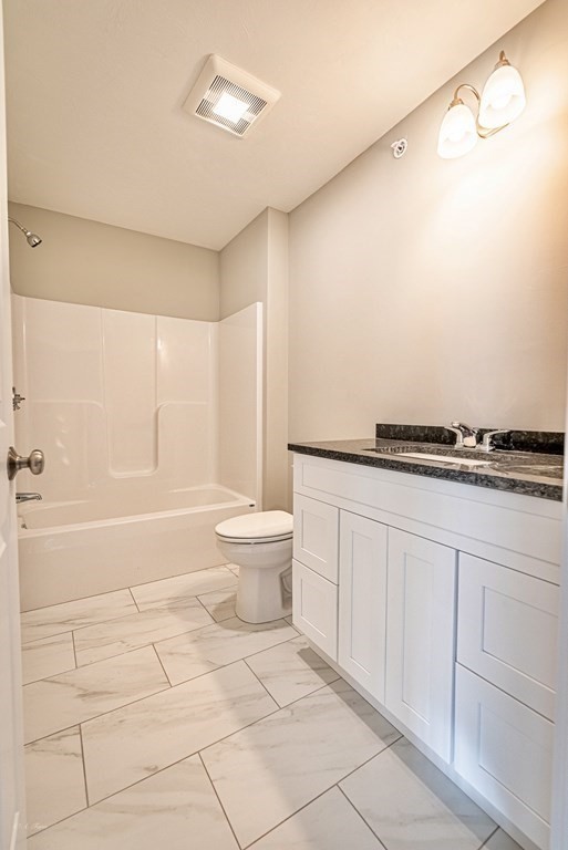 49 Riverside Drive, Unit 49A Lakeville, MA 02347 - Photo 25 of 31 a bathroom with a sink a toilet and shower