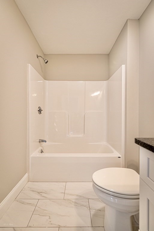 49 Riverside Drive, Unit 49A Lakeville, MA 02347 - Photo 26 of 31 a bathroom with a bathtub and a toilet