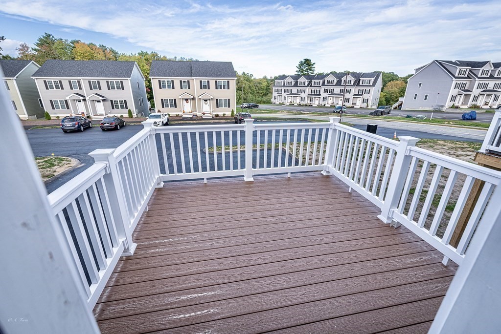49 Riverside Drive, Unit 49A Lakeville, MA 02347 - Photo 29 of 31 a view of a balcony with wooden floor