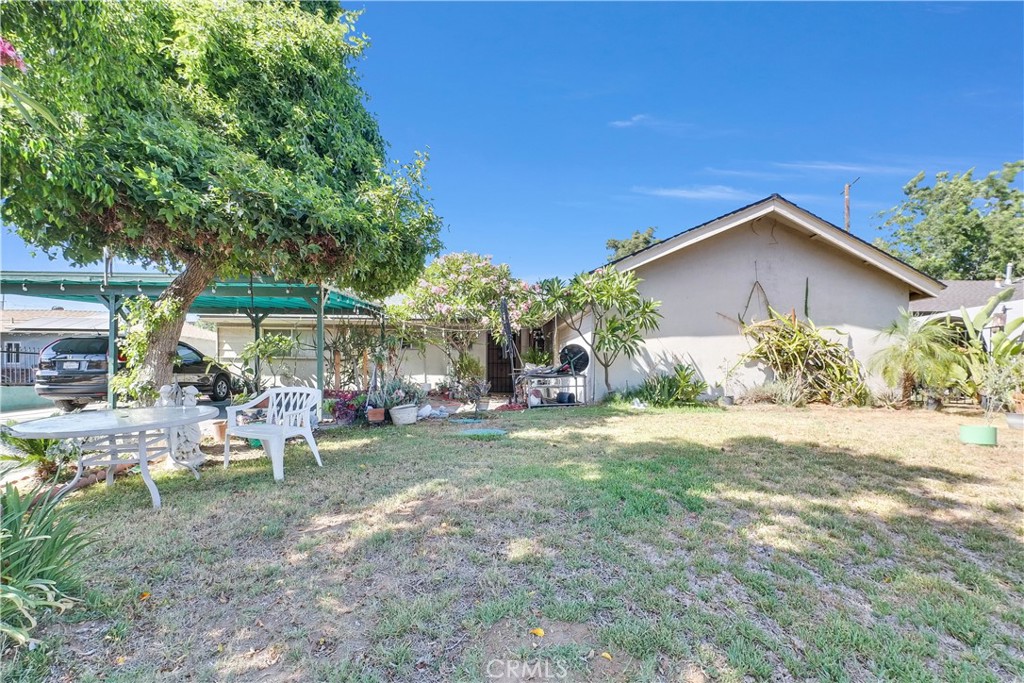 3261 Viola Drive Riverside, CA 92501 - Photo 1 of 21 a view of a chair and table in backyard of the house