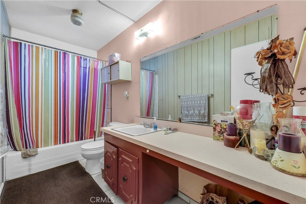 3261 Viola Drive Riverside, CA 92501 - Photo 13 of 21 a bathroom with a sink and a mirror