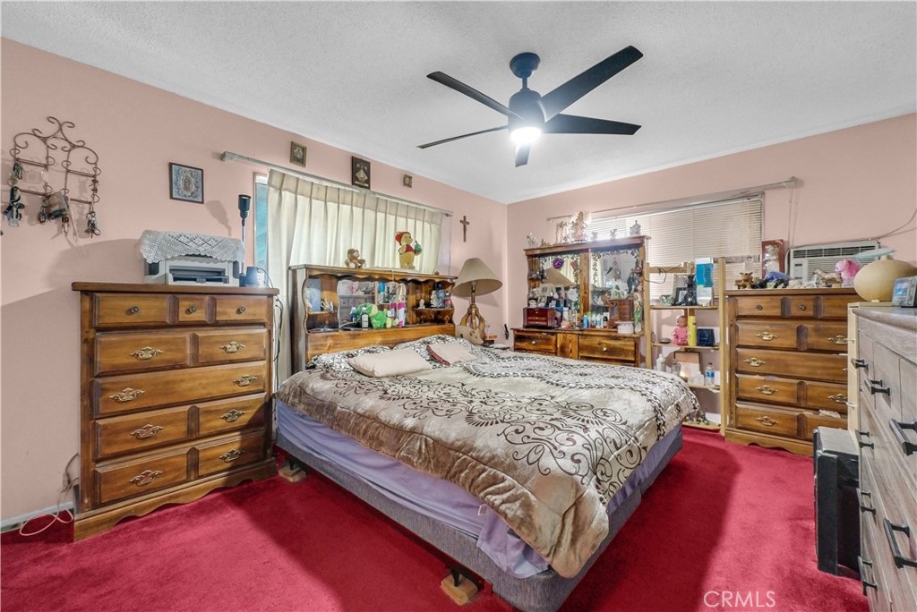 3261 Viola Drive Riverside, CA 92501 - Photo 14 of 21 a bed room with a bed and a walk in closet