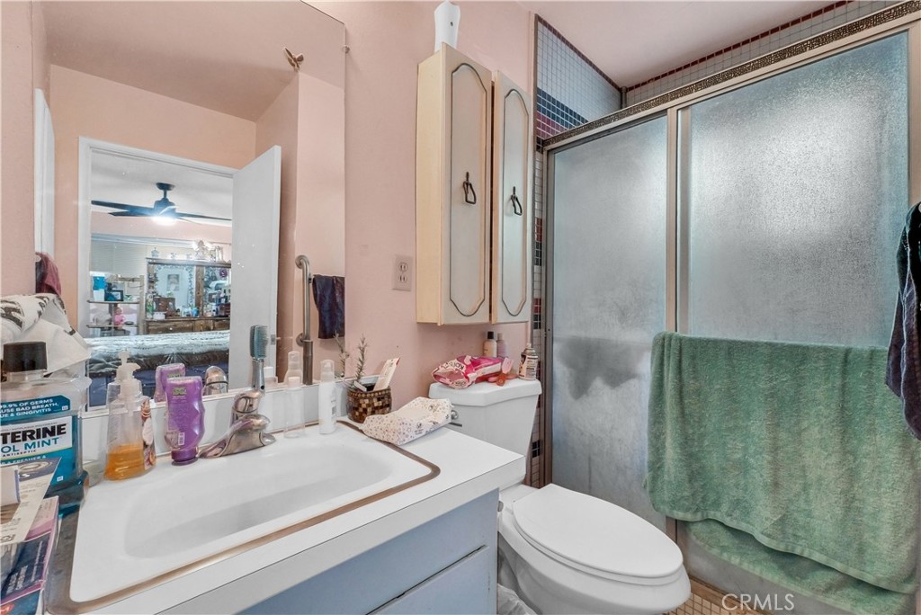 3261 Viola Drive Riverside, CA 92501 - Photo 16 of 21 a bathroom with a sink toilet vanity and shower