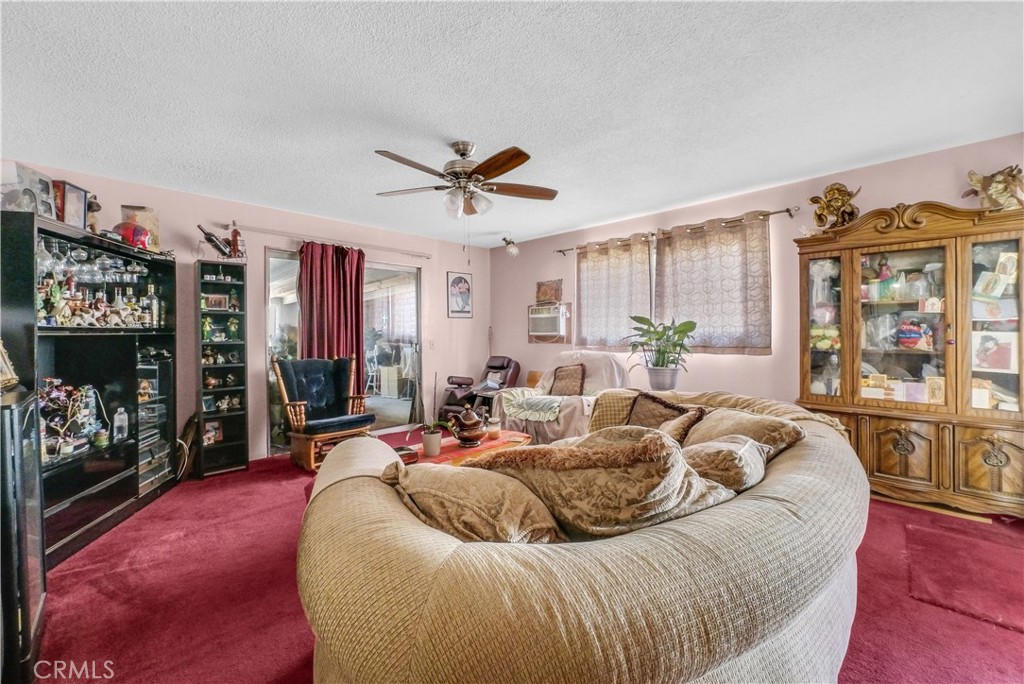 3261 Viola Drive Riverside, CA 92501 - Photo 4 of 21 a living room with furniture a couch and a window