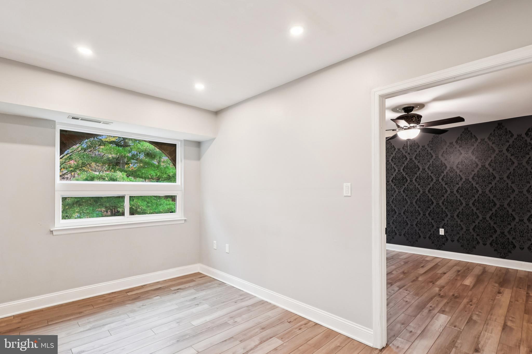 10 Silverwood Circle, Unit 10 Annapolis, MD 21403 - Photo 31 of 58 an empty room with wooden floor and a window