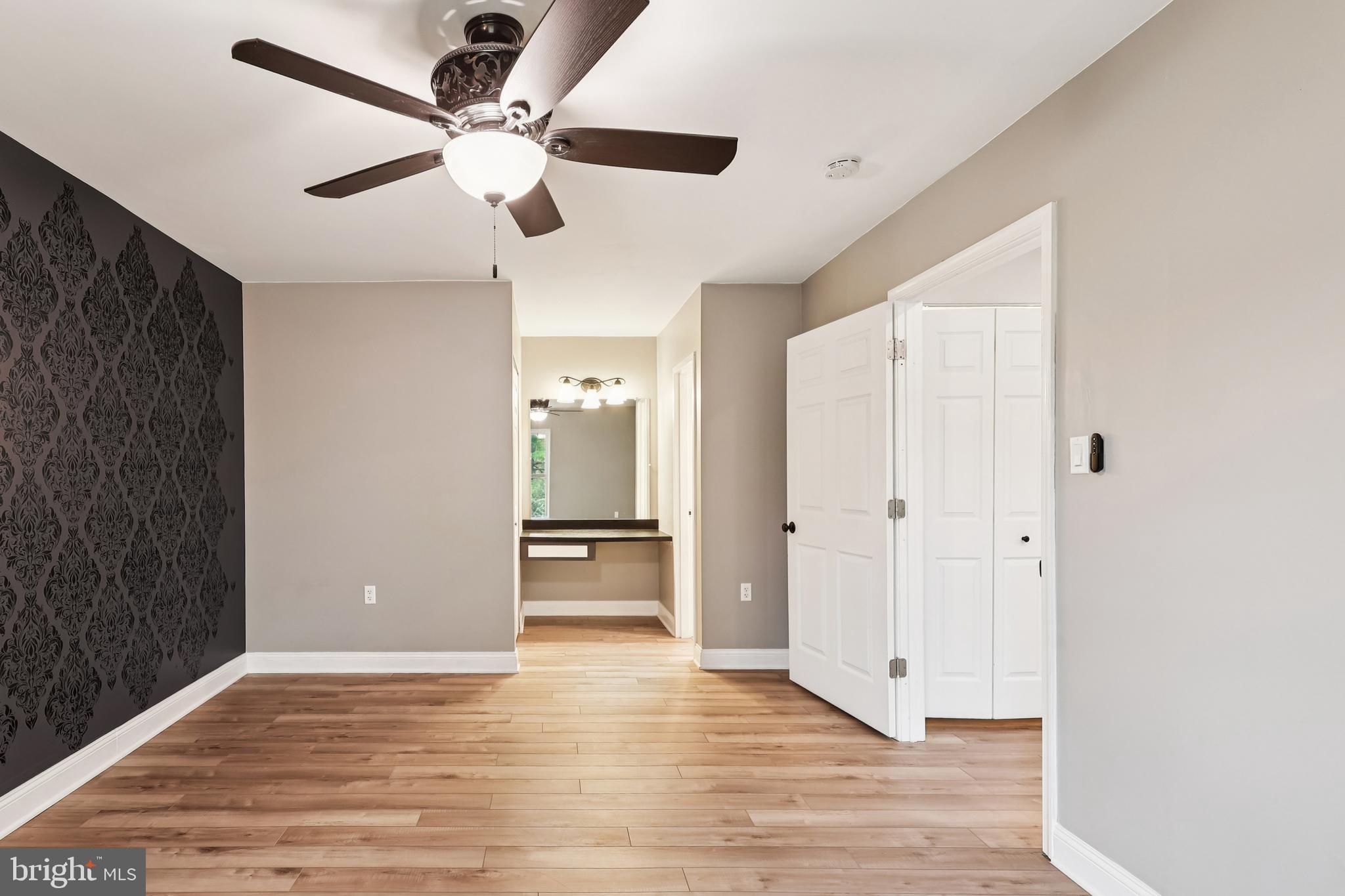 10 Silverwood Circle, Unit 10 Annapolis, MD 21403 - Photo 39 of 58 an empty room with wooden floor and a ceiling fan
