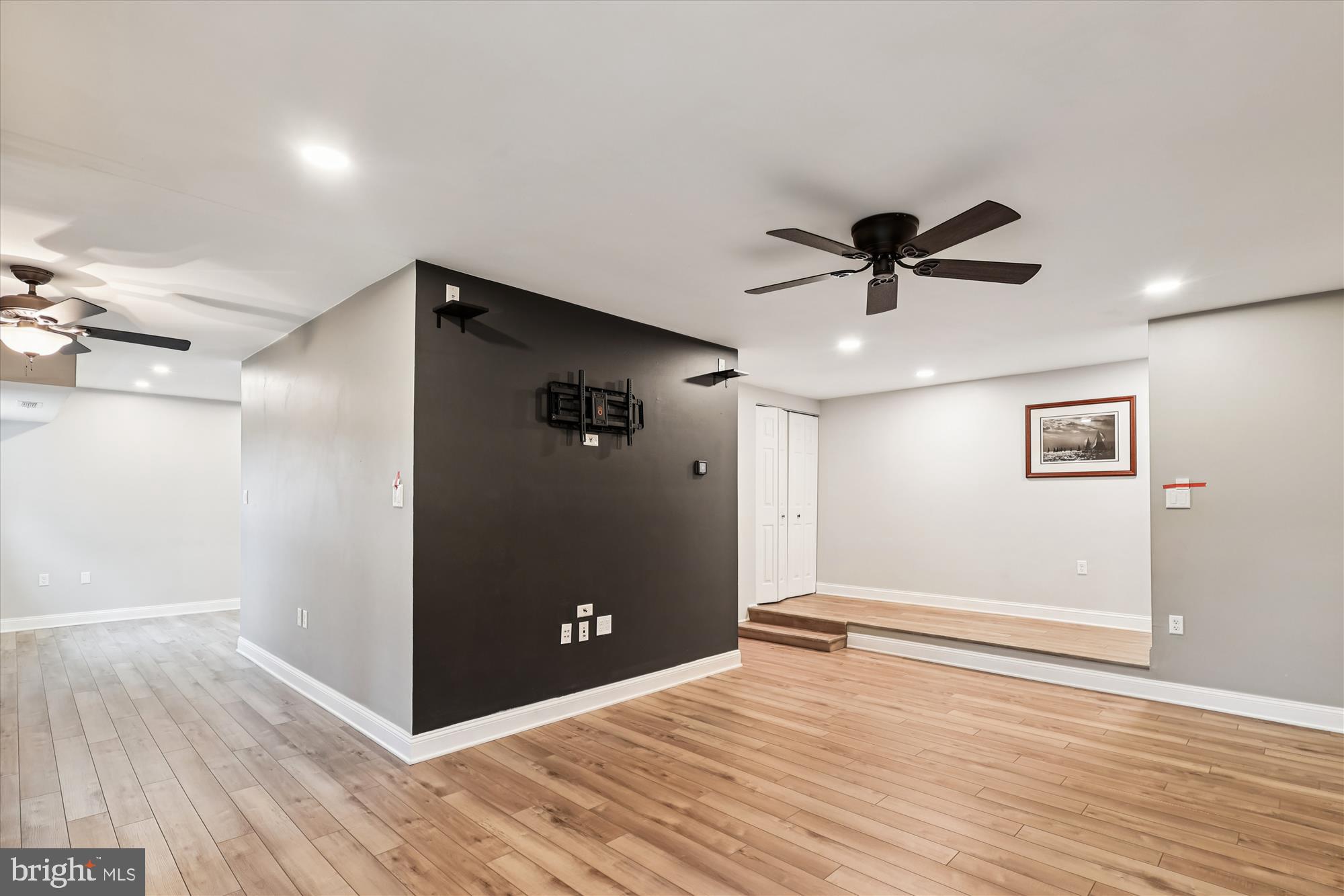10 Silverwood Circle, Unit 10 Annapolis, MD 21403 - Photo 42 of 58 a view of a livingroom with a ceiling fan & wooden floor