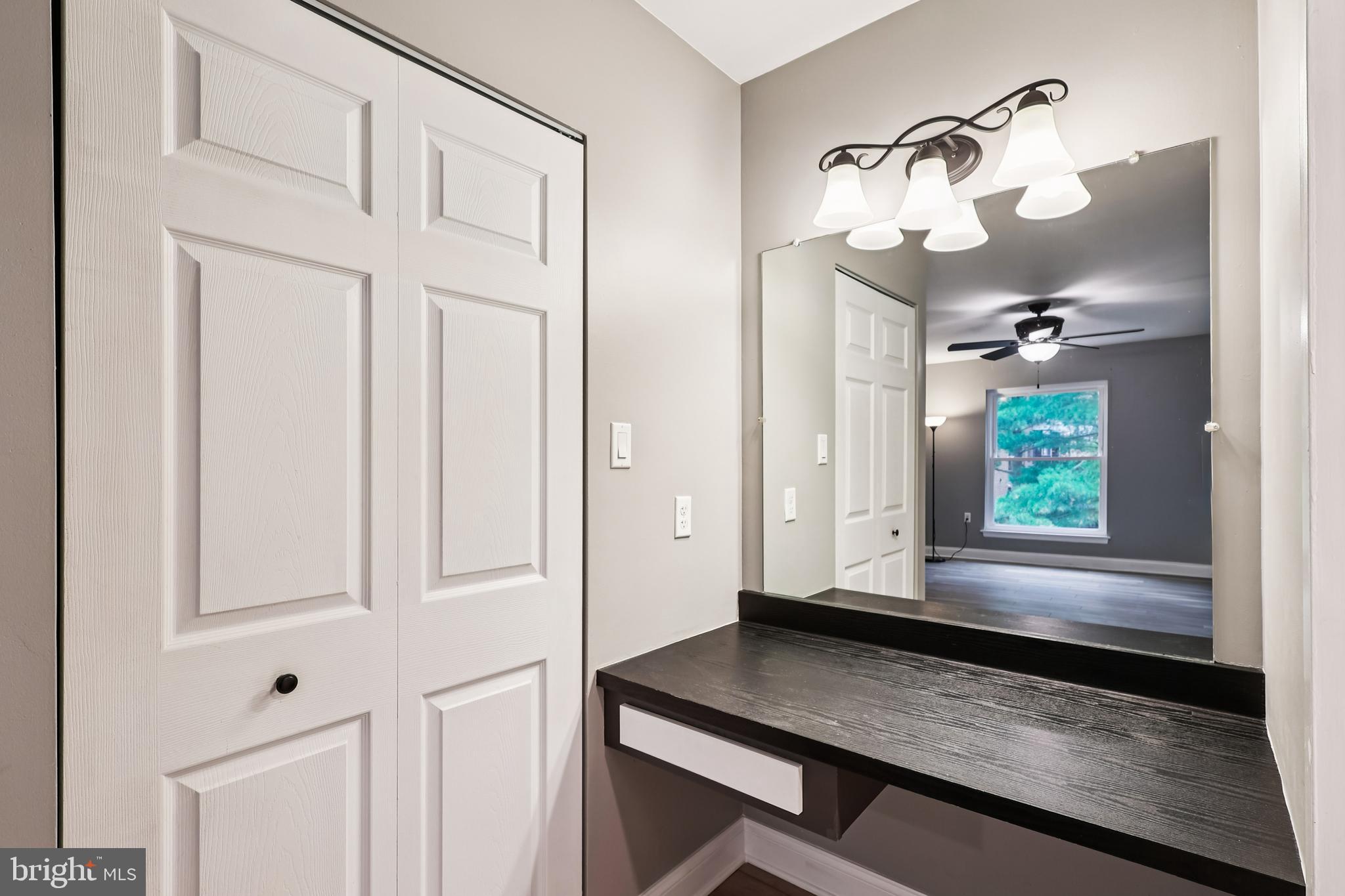 10 Silverwood Circle, Unit 10 Annapolis, MD 21403 - Photo 43 of 58 a view of a hallway with wooden floor and cabinet