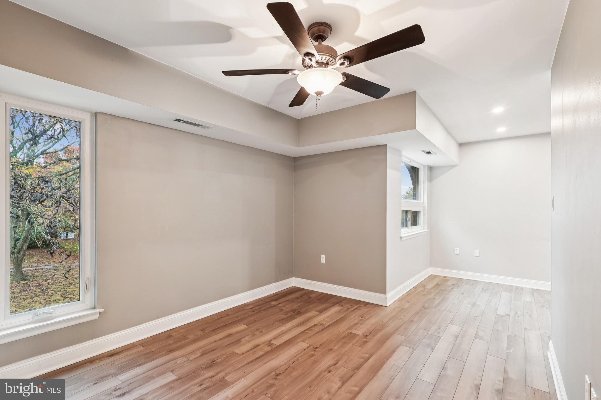 10 Silverwood Circle, Unit 10 Annapolis, MD 21403 - Photo 5 of 58 a view of an empty room with wooden floor and a window