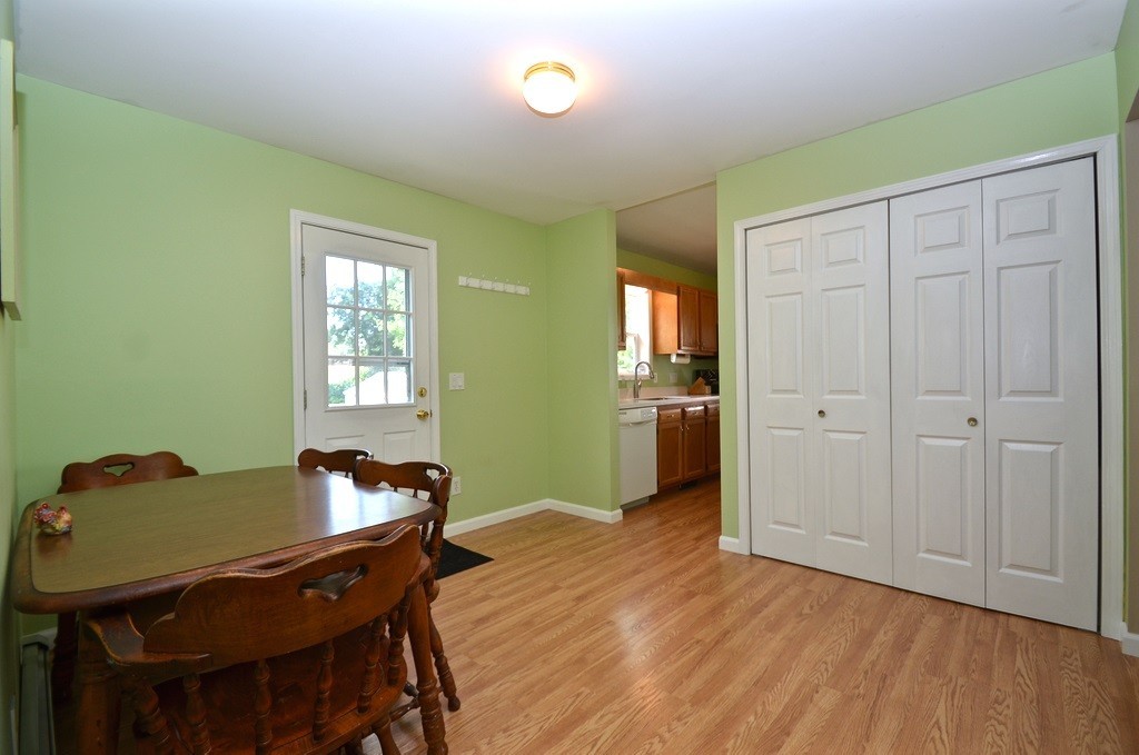 151 Fitch Road Clinton, MA 01510 - Photo 11 of 25 a view of a dining room with furniture and wooden floor