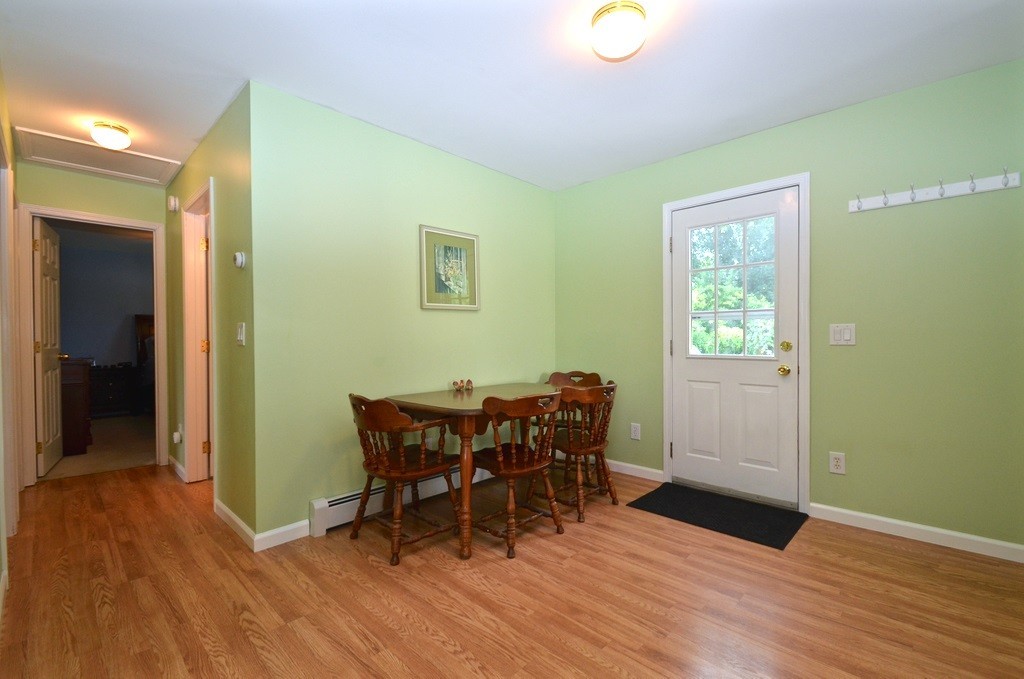 151 Fitch Road Clinton, MA 01510 - Photo 12 of 25 a view of a dining room with furniture and wooden floor