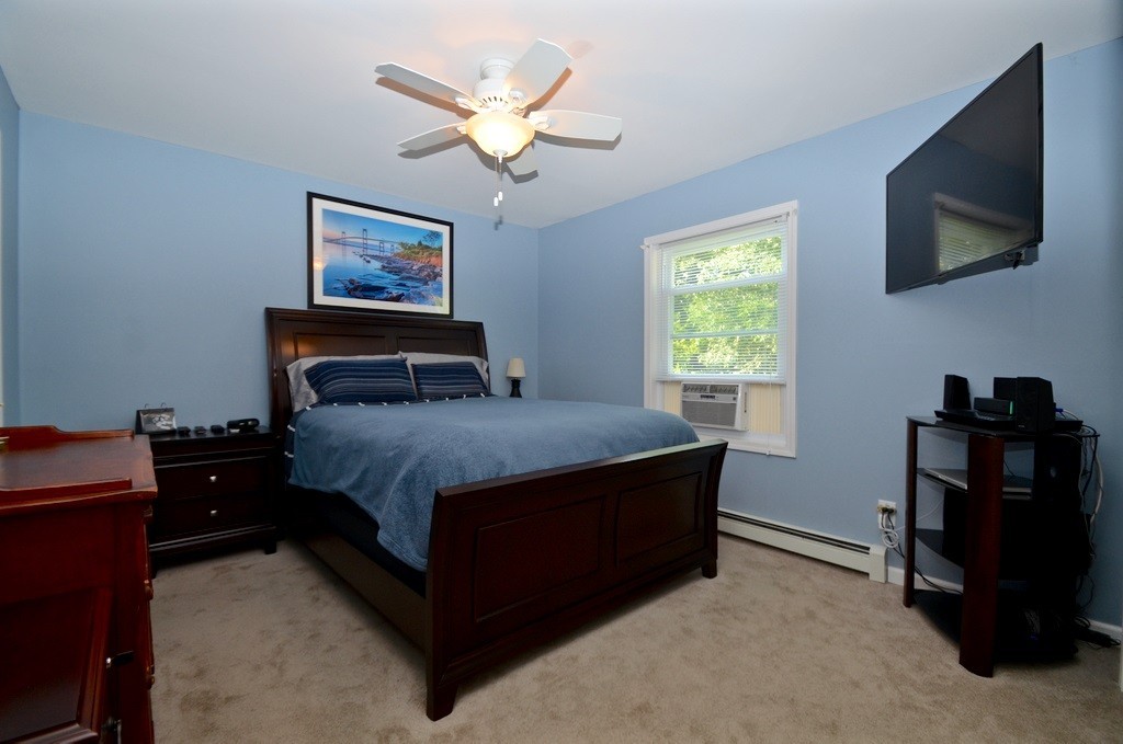 151 Fitch Road Clinton, MA 01510 - Photo 13 of 25 a bedroom with a bed and a flat screen tv