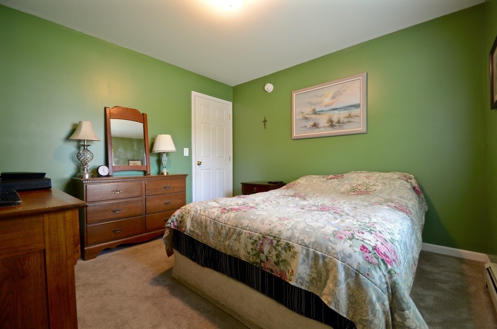 151 Fitch Road Clinton, MA 01510 - Photo 15 of 25 a bedroom with a bed and dresser