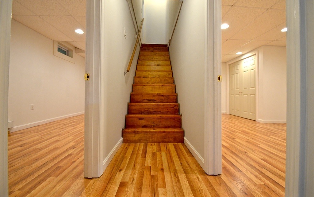 151 Fitch Road Clinton, MA 01510 - Photo 18 of 25 a view of a hallway with wooden floor and staircase