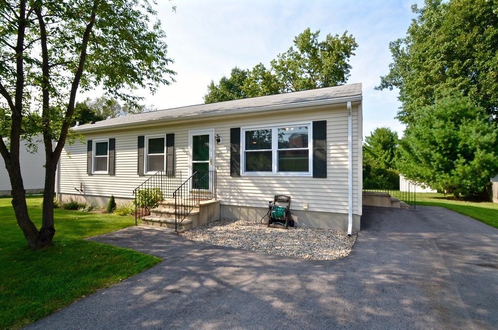 151 Fitch Road Clinton, MA 01510 - Photo 2 of 25 a view of a house with a yard and chairs
