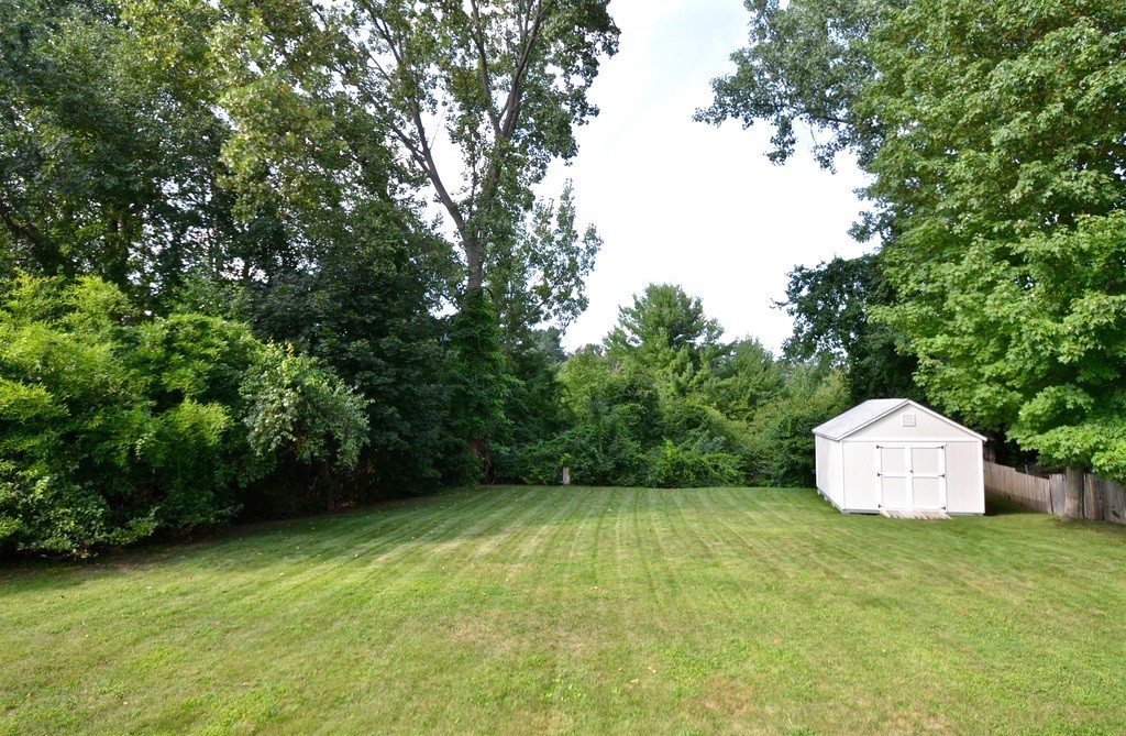151 Fitch Road Clinton, MA 01510 - Photo 23 of 25 a backyard of a house with lots of green space