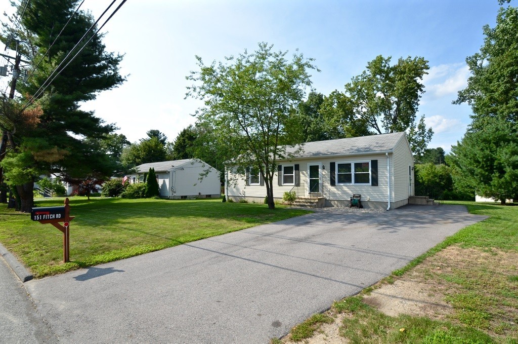 151 Fitch Road Clinton, MA 01510 - Photo 3 of 25 a front view of a house with a yard and porch