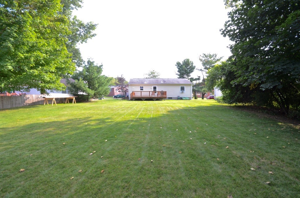 151 Fitch Road Clinton, MA 01510 - Photo 5 of 25 a view of a house with a big yard and large trees