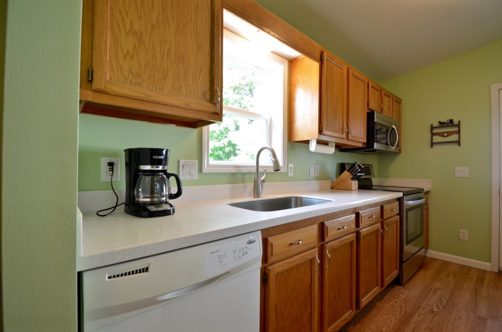 151 Fitch Road Clinton, MA 01510 - Photo 6 of 25 a kitchen with a sink and cabinets