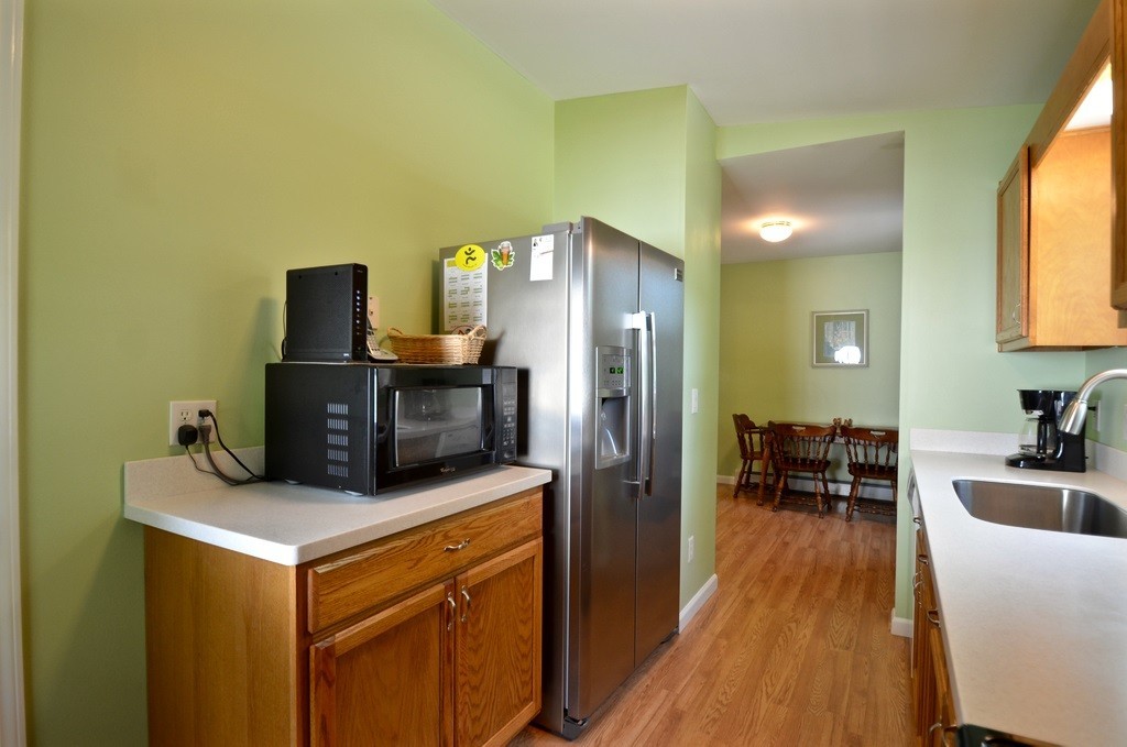 151 Fitch Road Clinton, MA 01510 - Photo 7 of 25 a kitchen that has a sink and a refrigerator
