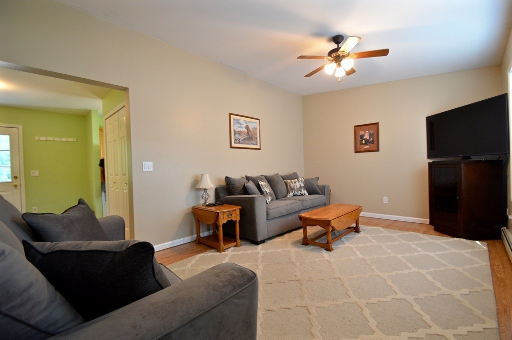 151 Fitch Road Clinton, MA 01510 - Photo 9 of 25 a living room with furniture and a flat screen tv
