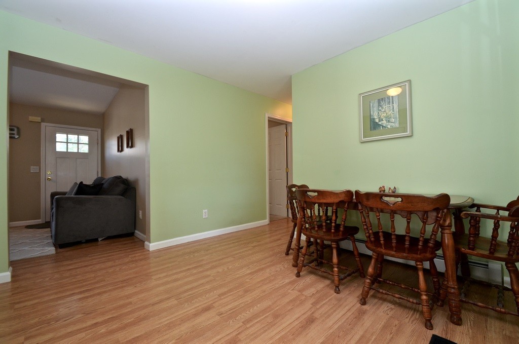 151 Fitch Road Clinton, MA 01510 - Photo 10 of 25 a view of a dining room with furniture and wooden floor