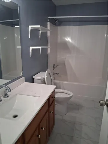 a view of a livingroom with a fireplace and wooden floor