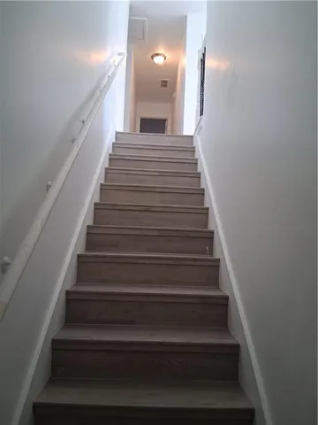 a kitchen with a refrigerator and a sink