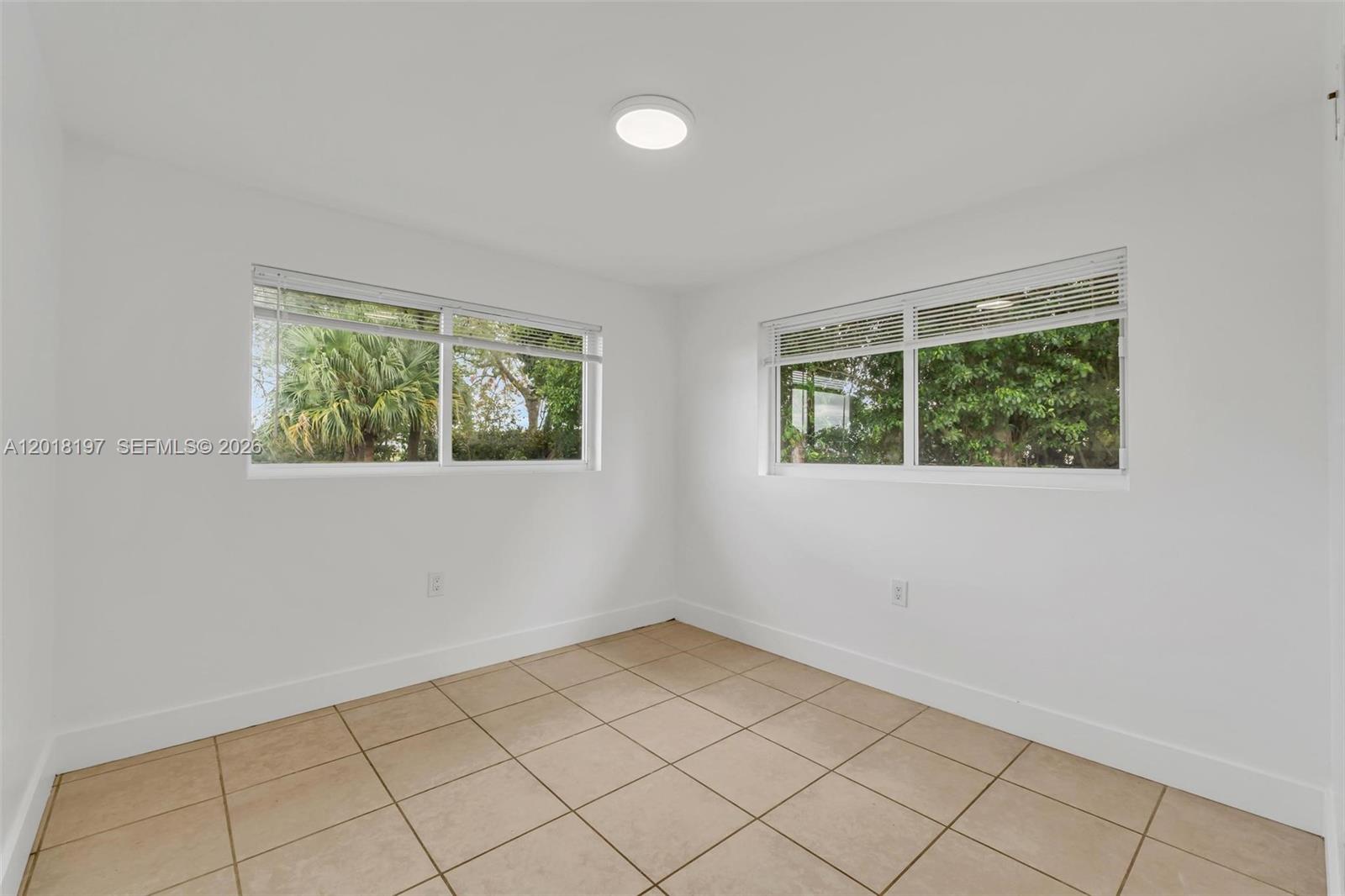 628 Southwest 8th Avenue Homestead, FL 33030 - Photo 21 of 25 an empty room with windows