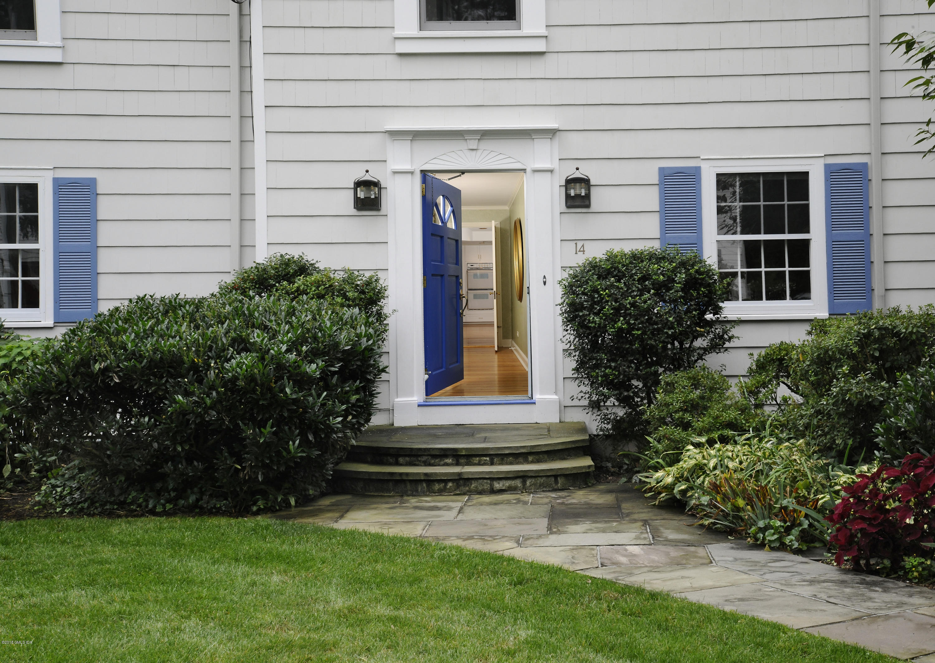 14 Knoll Street Riverside, CT 06878 - Photo 3 of 19 a front view of a house with garden
