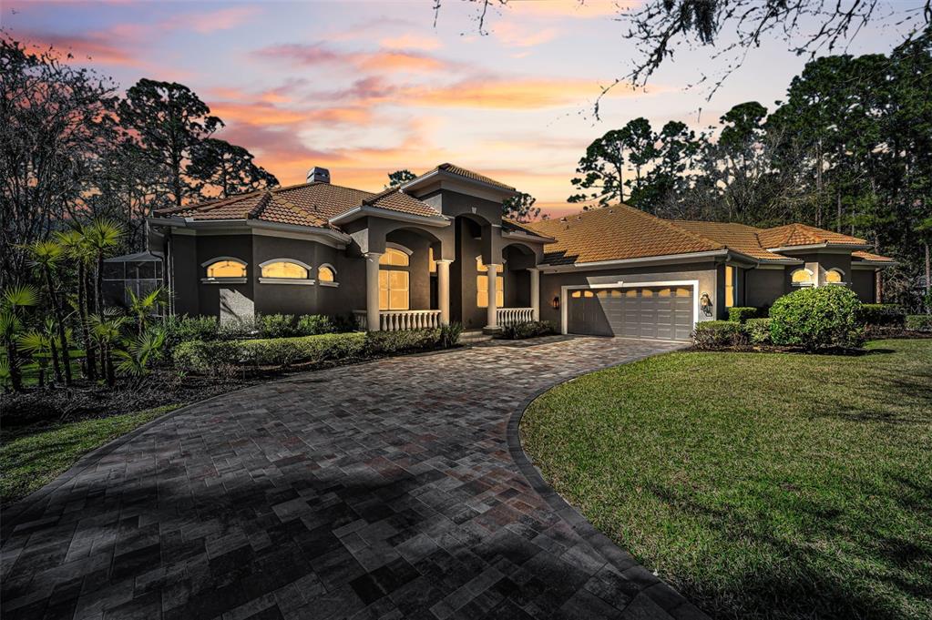 10709 Watula Court New Port Richey, FL 34655 - Photo 4 of 99 a front view of a house with garden