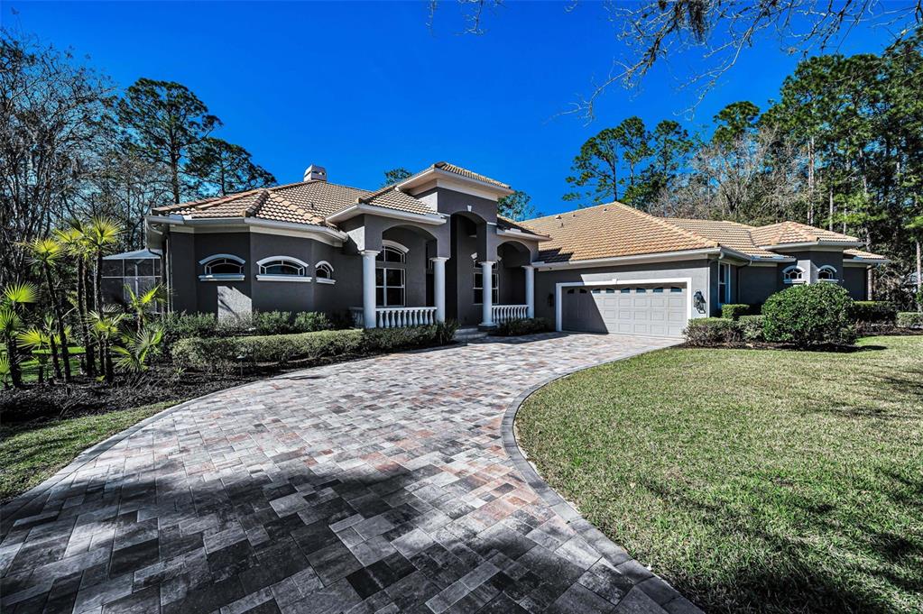 10709 Watula Court New Port Richey, FL 34655 - Photo 5 of 99 a front view of a house with a garden