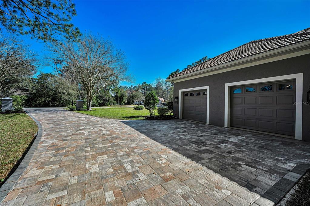 10709 Watula Court New Port Richey, FL 34655 - Photo 89 of 99 a view of a house with a yard