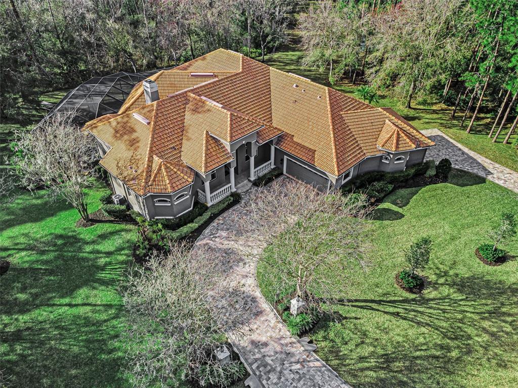 10709 Watula Court New Port Richey, FL 34655 - Photo 92 of 99 a view of a house with a yard