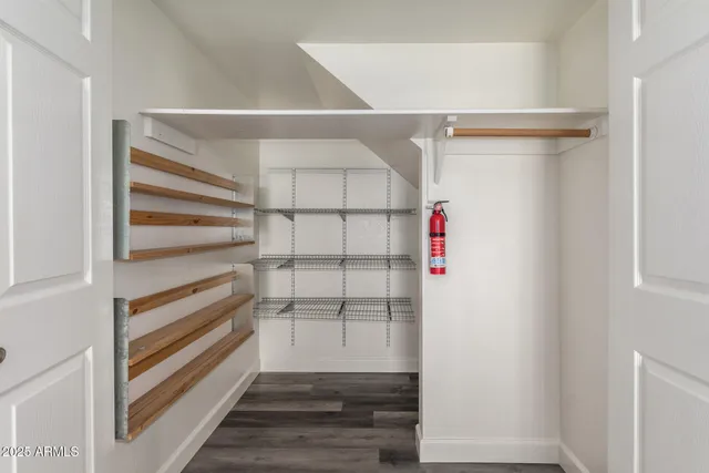 a view of an empty walk in closet