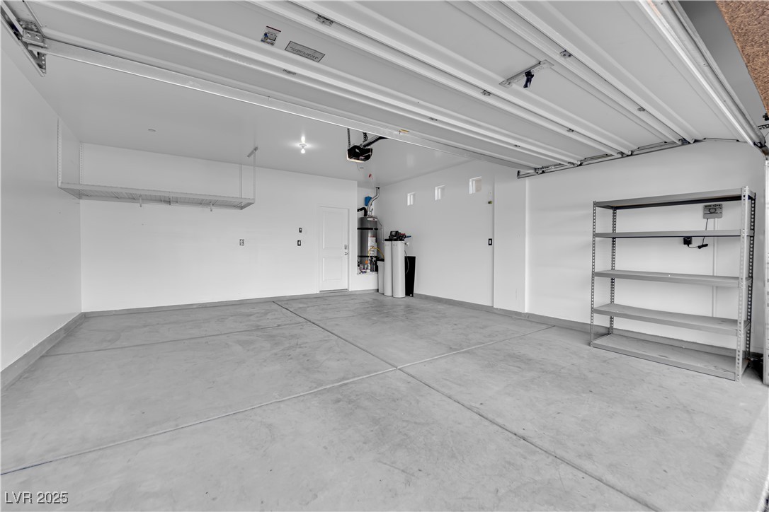 915 Harbor Avenue Henderson, NV 89002 - Photo 27 of 32 Garage featuring Convenient Hanging Storage, Water Softener, and Whole House Reverse Osmosis System