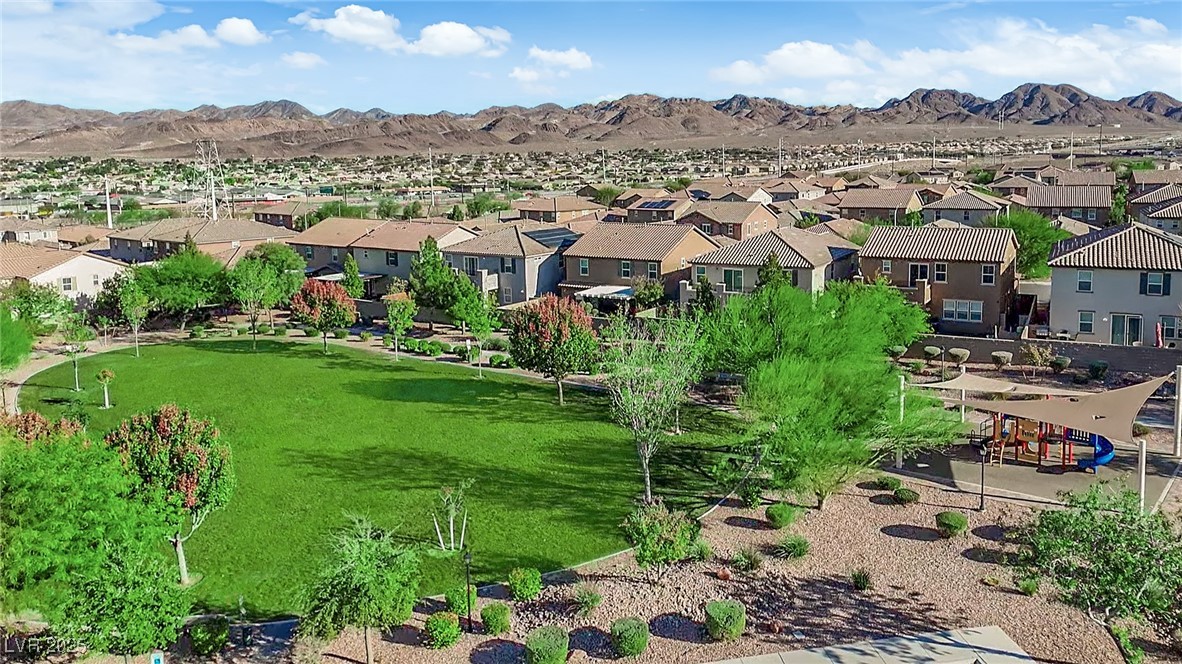 915 Harbor Avenue Henderson, NV 89002 - Photo 29 of 32 Aerial perspective of suburban area with a mountain backdrop