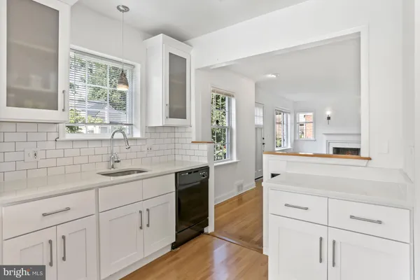 a spacious bathroom with a granite countertop sink mirror and a