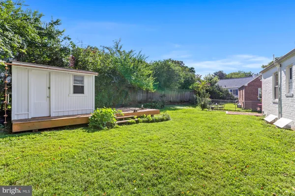 a view of yard with patio