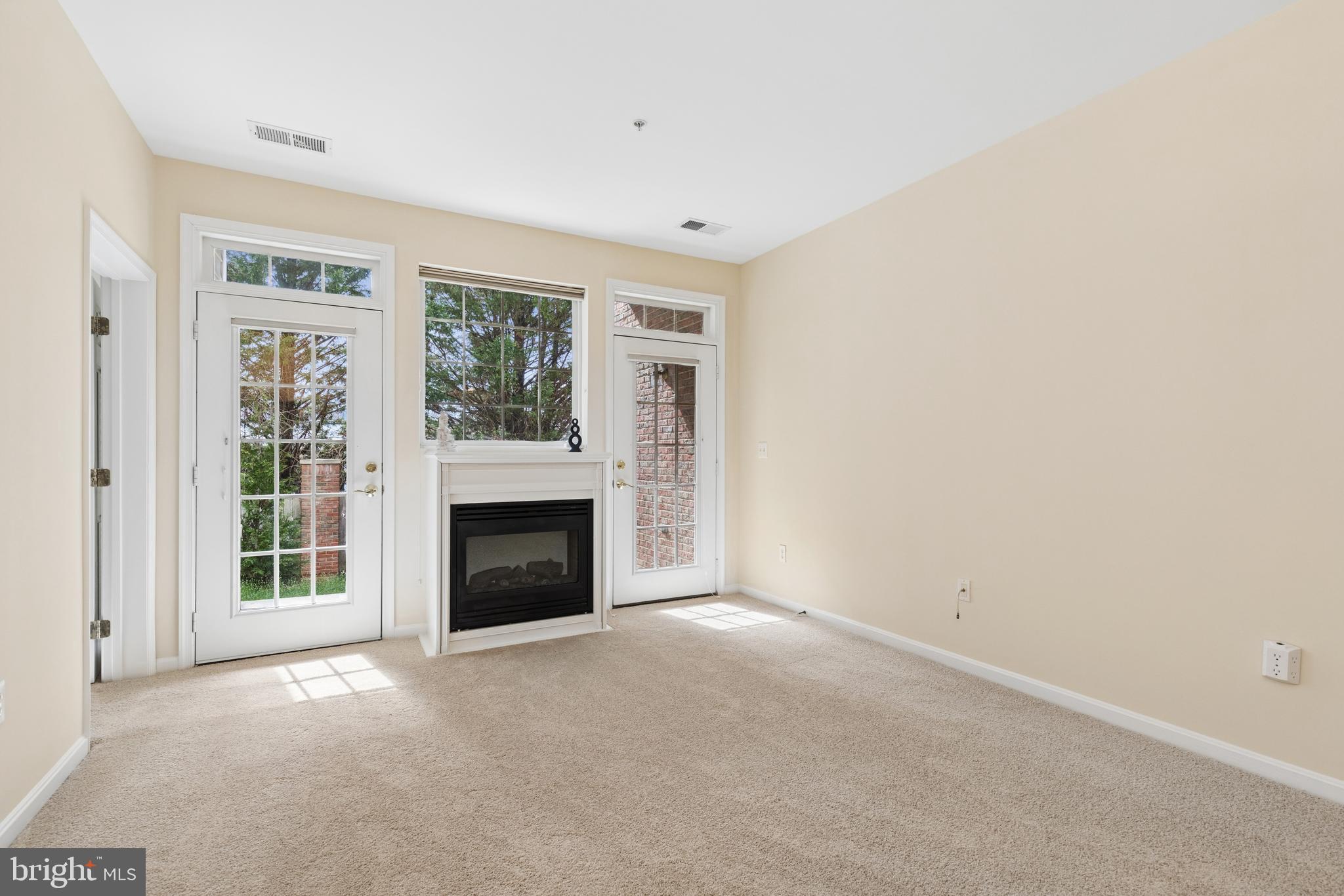 431 Hamlet Club Drive, Unit 102 Edgewater, MD 21037 - Photo 19 of 55 a view of a livingroom with a fireplace