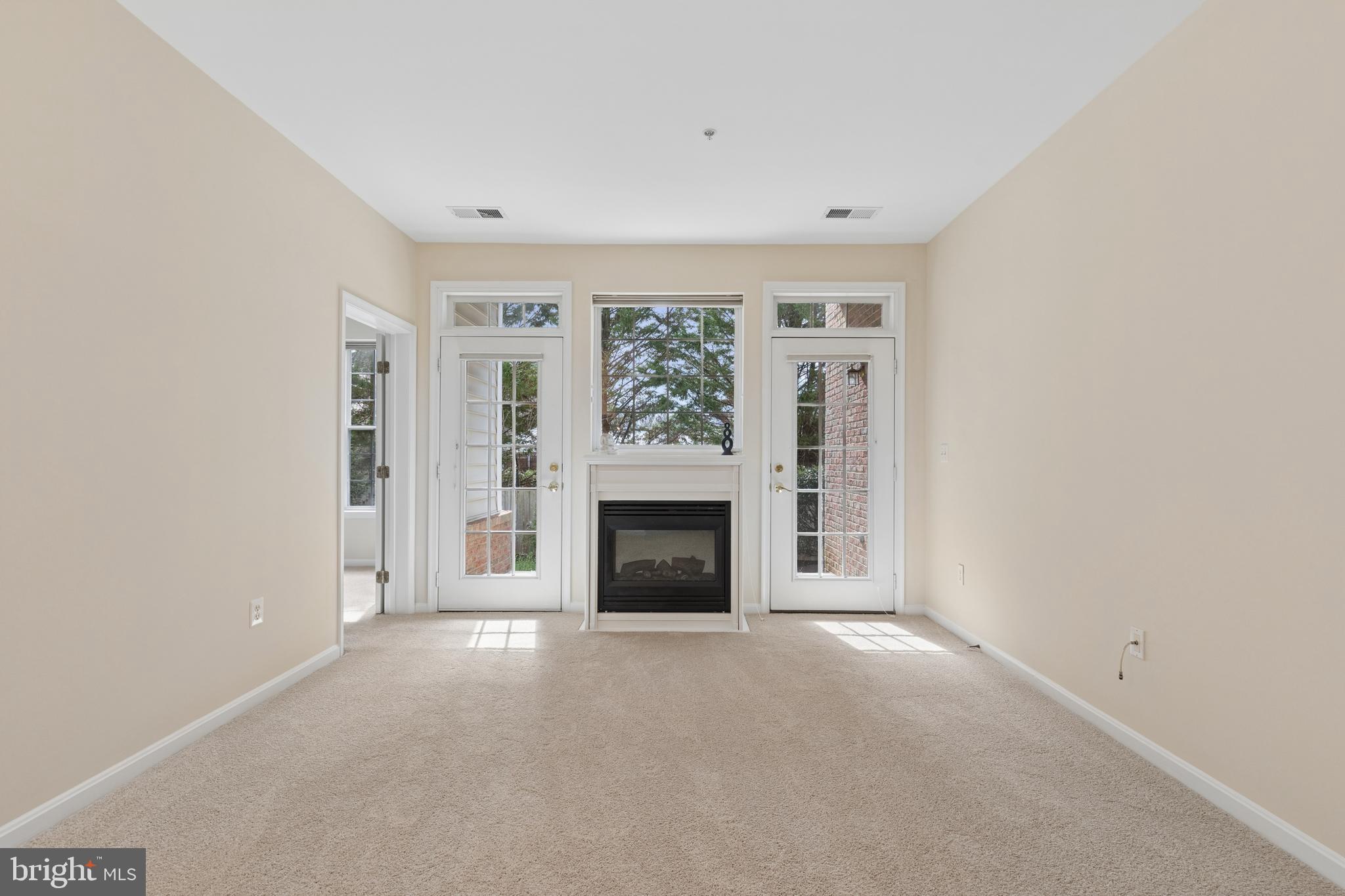 431 Hamlet Club Drive, Unit 102 Edgewater, MD 21037 - Photo 20 of 55 a view of a livingroom with a fireplace