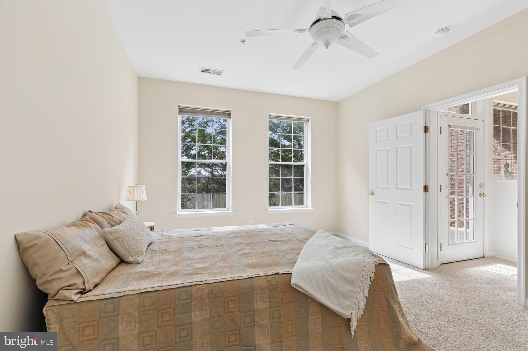 431 Hamlet Club Drive, Unit 102 Edgewater, MD 21037 - Photo 24 of 55 a bedroom with a bed and window