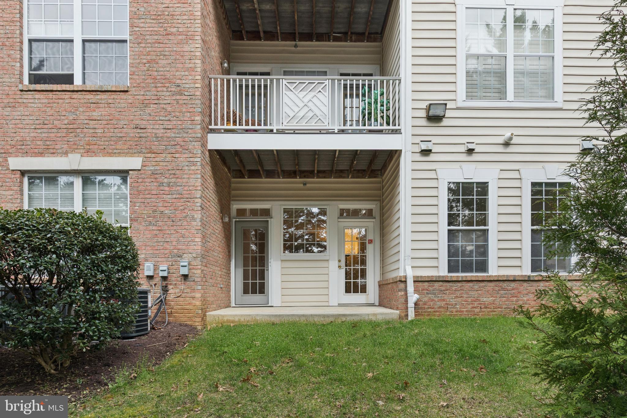 431 Hamlet Club Drive, Unit 102 Edgewater, MD 21037 - Photo 38 of 55 a front view of a house with a garden